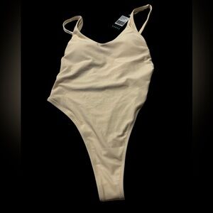 Relleciga one piece thong swimsuit in cream